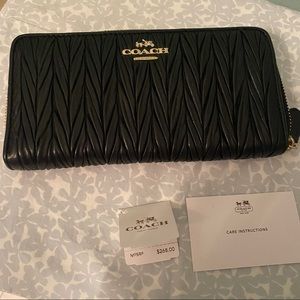Coach Black texture leather acc zip wallet . Brand new with tags.